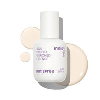 White bottle of Jeju Orchid enriched essence with beige serum droplets on a white background highlighting anti-aging care