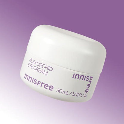 Small white jar of innisfree Jeju Orchid Eye Cream highlighting hydration benefits on a purple gradient background
