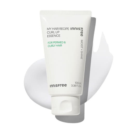 White tube of lightweight curl-up essence for permed and curly hair with smooth cream texture background