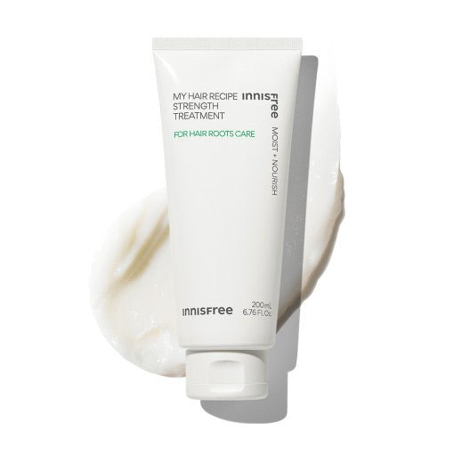 White tube of hair strength treatment with smooth cream texture swatch emphasizing moisture and nourishment benefits