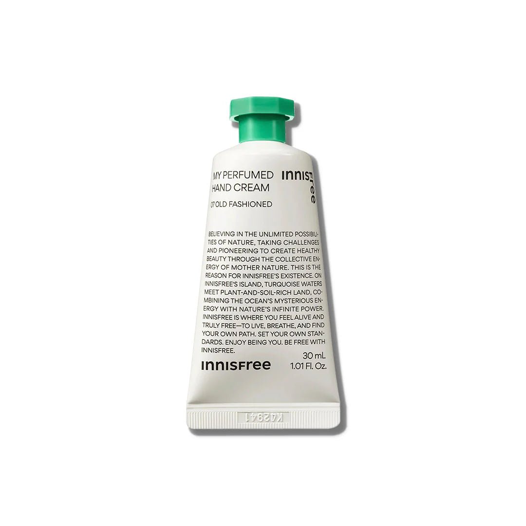 White tube of moisturizing perfumed hand cream with green cap and black text on a white background