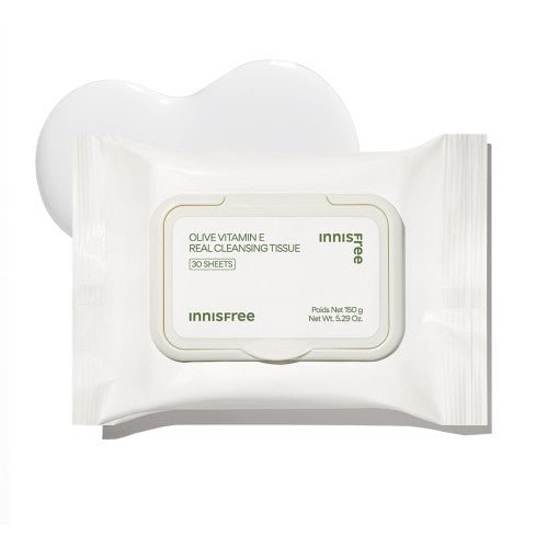 White pack of cleansing tissues with olive vitamin E label placed on smooth creamy texture background