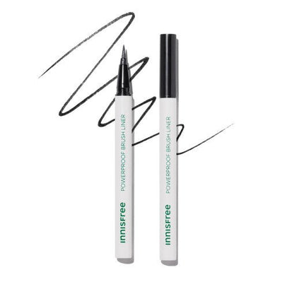White brush liner pen with fine tip and bold black strokes showcasing precise application on white background