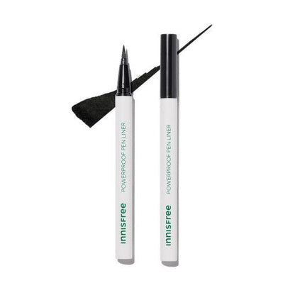 Two white pen liners with green text, one uncapped showing fine black tip and black ink stroke on white background