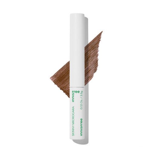 Slim white tube mascara with fine brush and rich brown formula stroke for precise lash definition
