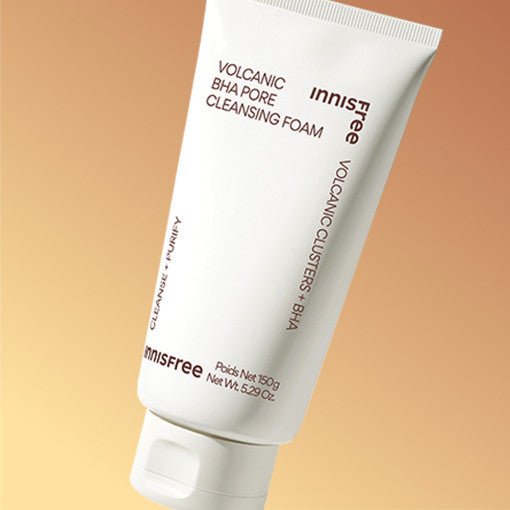 White tube of volcanic BHA pore cleansing foam with minimalist text on warm beige background