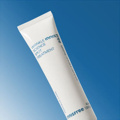 White tube of innisfree wrinkle spot treatment with blue text on gradient blue background