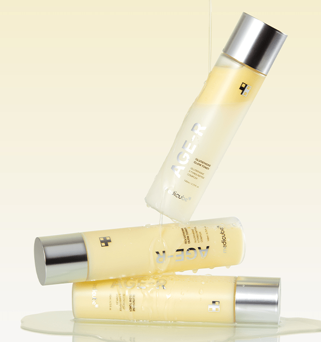 medicube AGE-R Glutathione Glow Toner 140ml with brightening effect shown with liquid pouring between sleek bottles