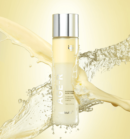 medicube AGE-R Glutathione Glow Toner 140ml with brightening effect shown against dynamic splashes of liquid