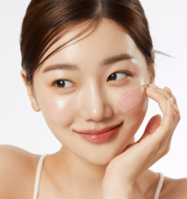 woman applying medicube Collagen Jelly Cream 50ml with smooth glowing skin and gentle smile