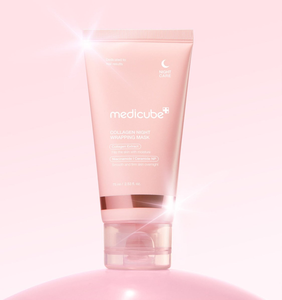 medicube Collagen Night Wrapping Mask 75ml pink tube with shiny accents on soft pink background for enhanced elasticity care