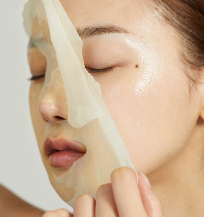 medicube Deep Vita C Daily Quick Mask 350ml/30Sheets being gently removed showing bright, glowing skin underneath