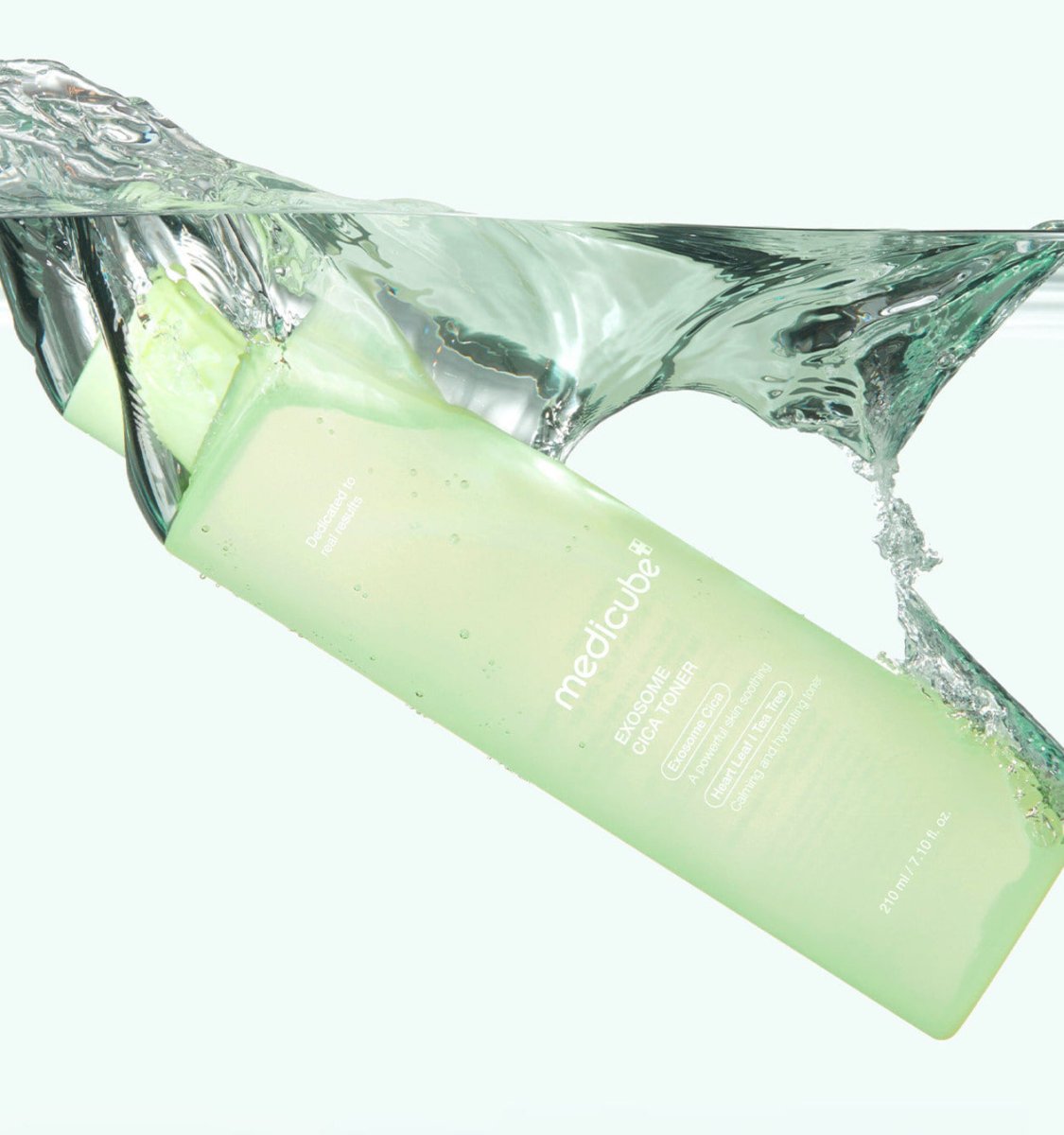 medicube Exosome Cica Toner 210ml in green bottle with soothing formula immersed in clear water splash
