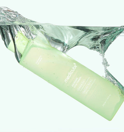 medicube Exosome Cica Toner 210ml in green bottle with soothing formula immersed in clear water splash