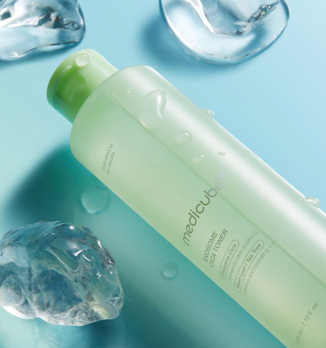 medicube Exosome Cica Toner 210ml in light green bottle with water droplets surrounded by cooling ice cubes for soothing effect