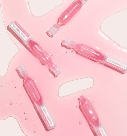 medicube PDRN Pink One Day Serum 1box(1.5ml*10ea) in salmon pink ampoules with intensive treatment serum spilled on surface