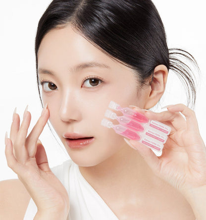 medicube PDRN Pink One Day Serum 1box(1.5ml*10ea) held by woman with clear skin for intensive treatment