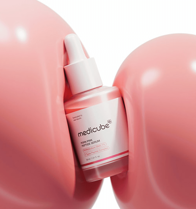 medicube PDRN Pink Peptide Serum 30ml bottle with dropper surrounded by soft pink rounded shapes promoting enhanced elasticity