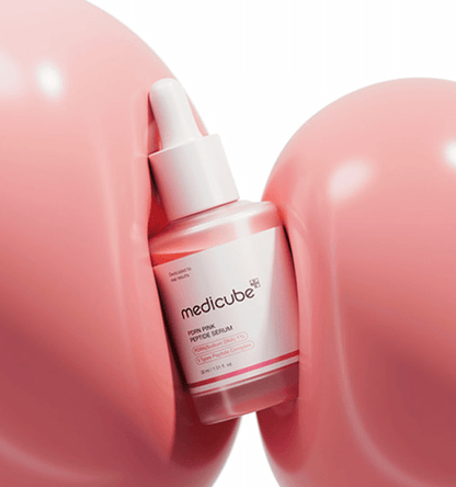 medicube PDRN Pink Peptide Serum 30ml bottle with dropper surrounded by soft pink rounded shapes promoting enhanced elasticity