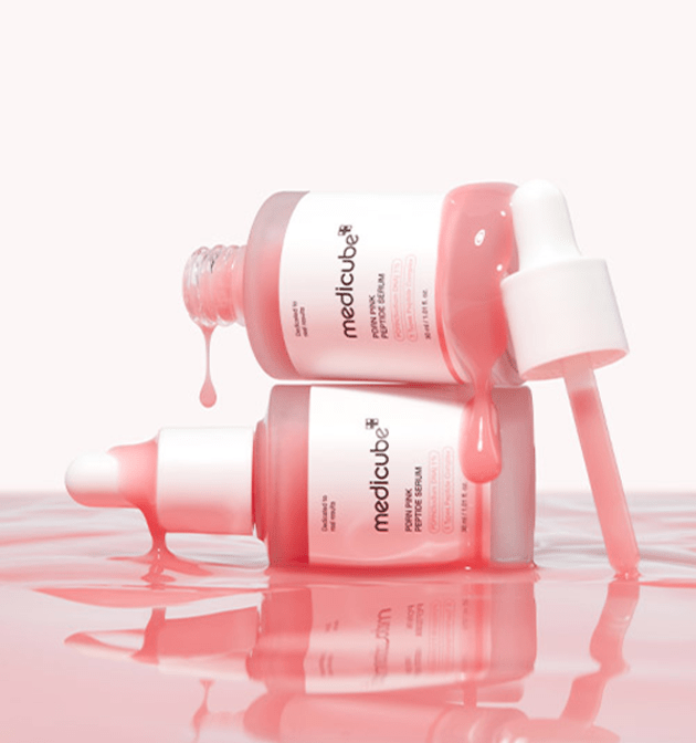 medicube PDRN Pink Peptide Serum 30ml bottles with pink serum dripping to emphasize enhanced elasticity care