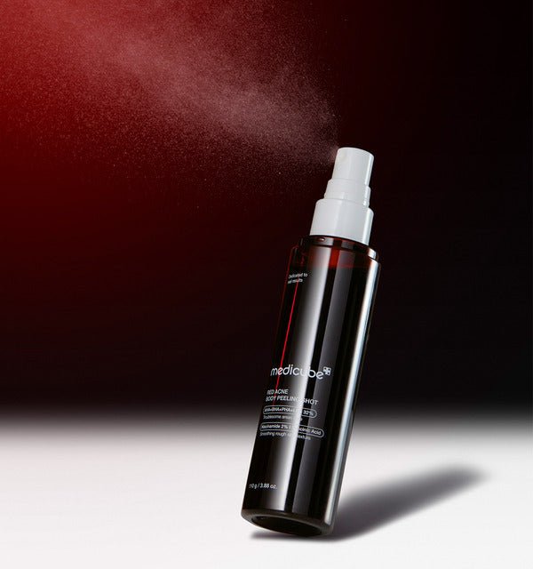 medicube Red Acne Body Peeling Shot 110g in dark bottle with white spray releasing fine mist for effective peeling