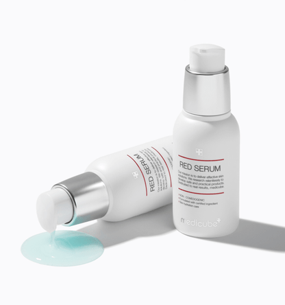 medicube Red Serum 2.0 30ml with hypoallergenic formula in white bottles, one dispensing light blue serum liquid on white background