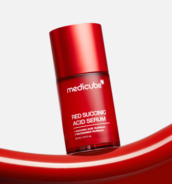 medicube Red Succinic Acid Serum 30ml in red packaging with acne relief benefits and smooth glossy red accents