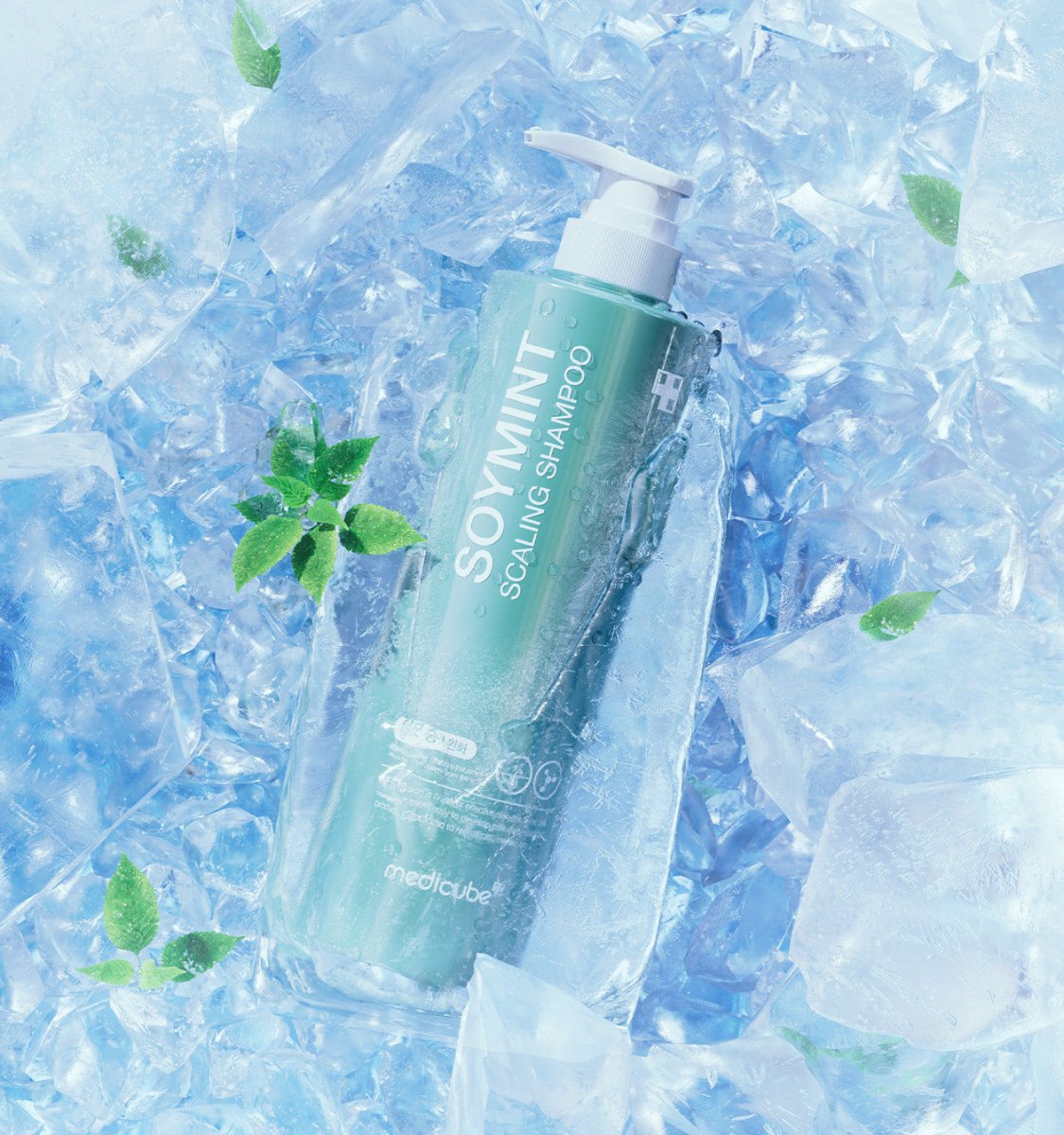 medicube SOYMINT Scaling Shampoo 490ml bottle surrounded by ice and green leaves representing cooling dandruff relief