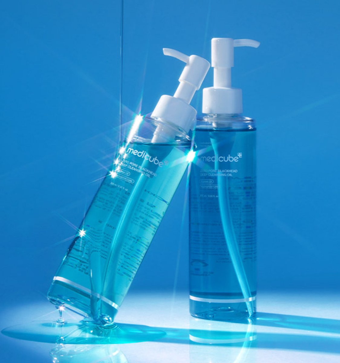 medicube Zero Pore Blackhead Deep Cleansing Oil 205ml clear blue liquid in clear bottles with white pump dispensers
