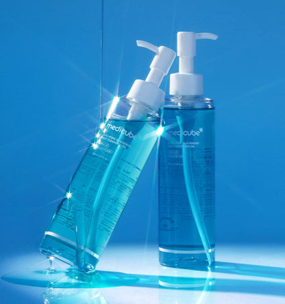 medicube Zero Pore Blackhead Deep Cleansing Oil 205ml clear blue liquid in clear bottles with white pump dispensers