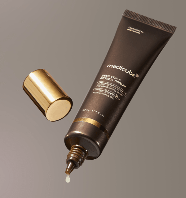medicube Deep Vita A Retinol Serum 30ml in dark tube with gold cap, droplet visible to highlight collagen boost benefits