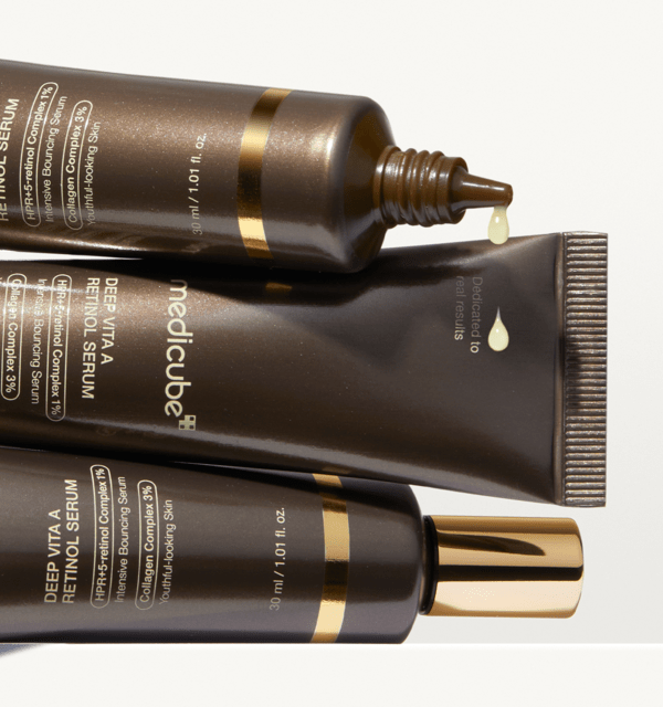 medicube Deep Vita A Retinol Serum 30ml in dark brown tubes with gold accents and anti-aging collagen boost formula