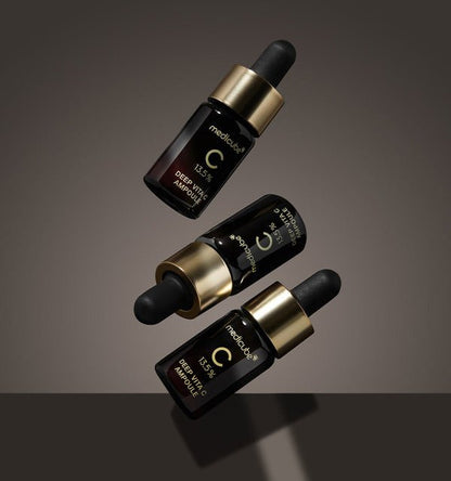 medicube Deep Vita C Ampoule 2.0 (10g x 3ea) three dark amber glass bottles with gold caps and droppers for brightening care