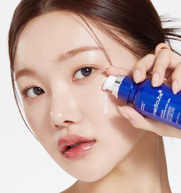 medicube One Day Exosome Shot Pore Ampoule 7500 30ml dispensing serum onto a woman's cheek for pore tightening benefits