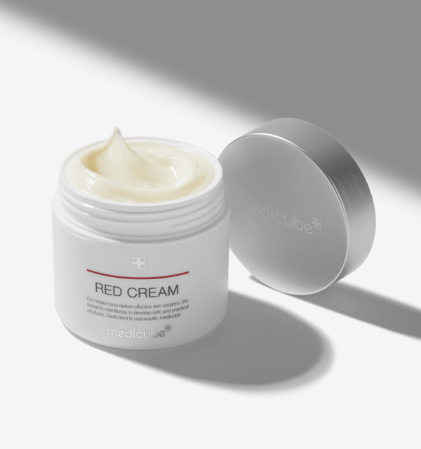 medicube Red Cream Plus 2.0 100ml open jar showing creamy hydrating formula with silver lid beside it