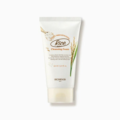 White tube of gentle rice-infused brightening cleansing foam with natural grain and plant design on white background