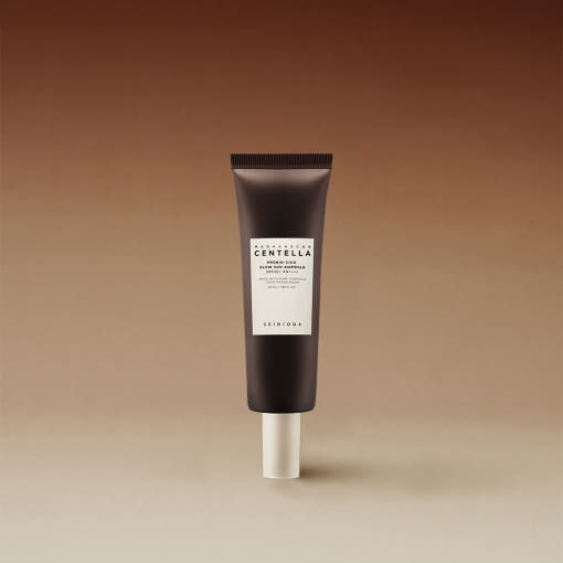 Brown tube of glow sun ampoule with white label indicating SPF 50+ PA++++ effective UV protection on gradient background