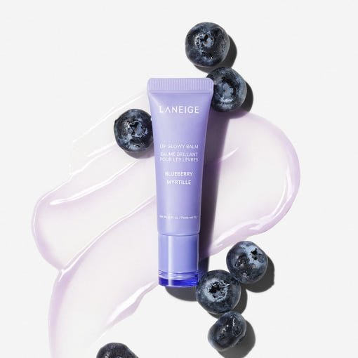 LANEIGE Lip Glowy Balm 10g in blueberry scent with rich moisture displayed alongside fresh blueberries and balm swatch