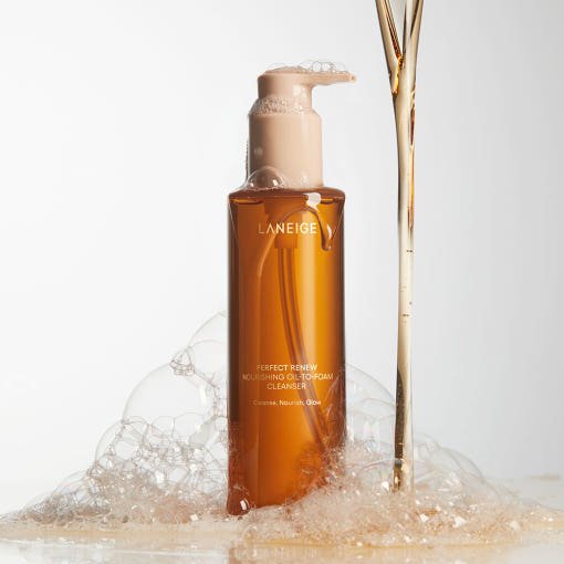 LANEIGE Perfect Renew Nourishing Oil-To-Foam Cleanser 200ml in amber bottle with foam bubbles for efficient cleansing