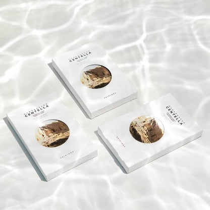 Three white watergel sheet mask packets with natural beige botanical illustration on rippling water surface