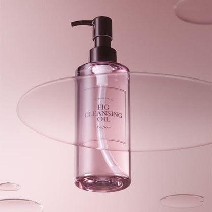 Transparent pink bottle of gentle cleansing oil with black pump on soft pink background with floating acrylic sheets