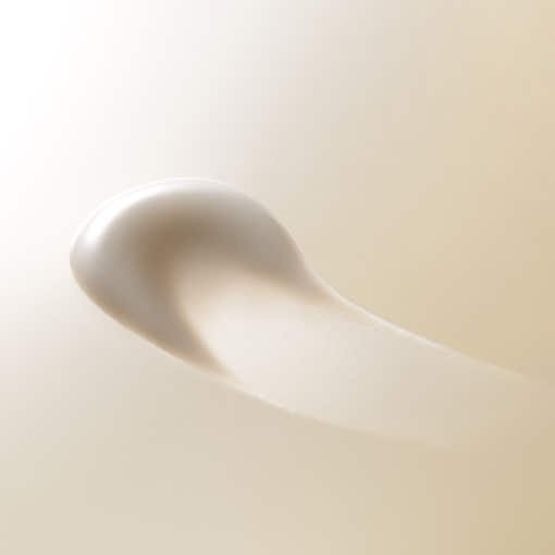 Creamy beige peel-off mask texture with smooth, radiant finish suggesting elasticity and glow benefits