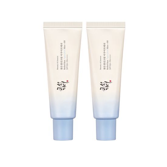 Two pale blue gradient tubes of hydration-boosting sun cream with minimal Korean text on a white background