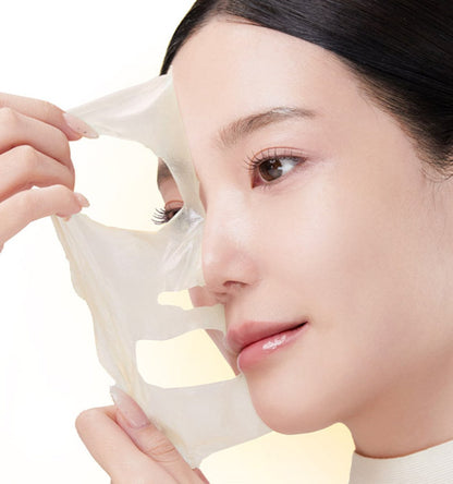 medicube Kojic Acid Turmeric Night Wrapping Mask 75ml being gently peeled off to reveal brightened skin effect