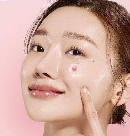 medicube PDRN Pink Collagen Capsule Cream 55ml applied on cheek showing radiant, glowing skin with light pink capsule cream texture