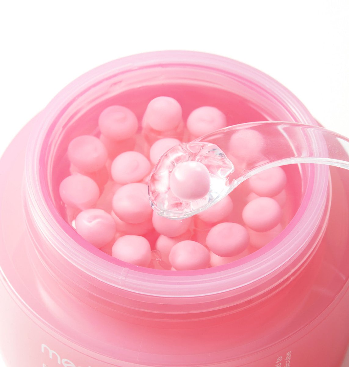 medicube PDRN Pink Collagen Capsule Cream 55ml with visible pink collagen capsules and a clear spatula scooping one up