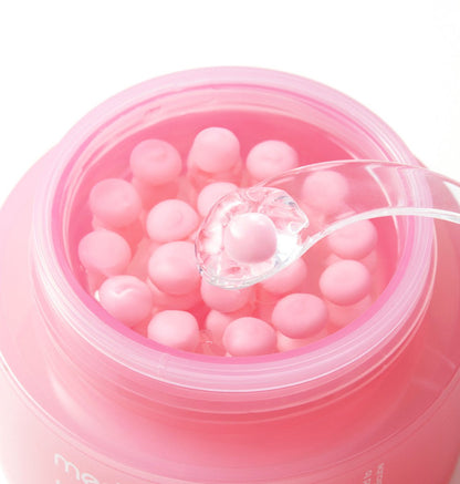 medicube PDRN Pink Collagen Capsule Cream 55ml with visible pink collagen capsules and a clear spatula scooping one up