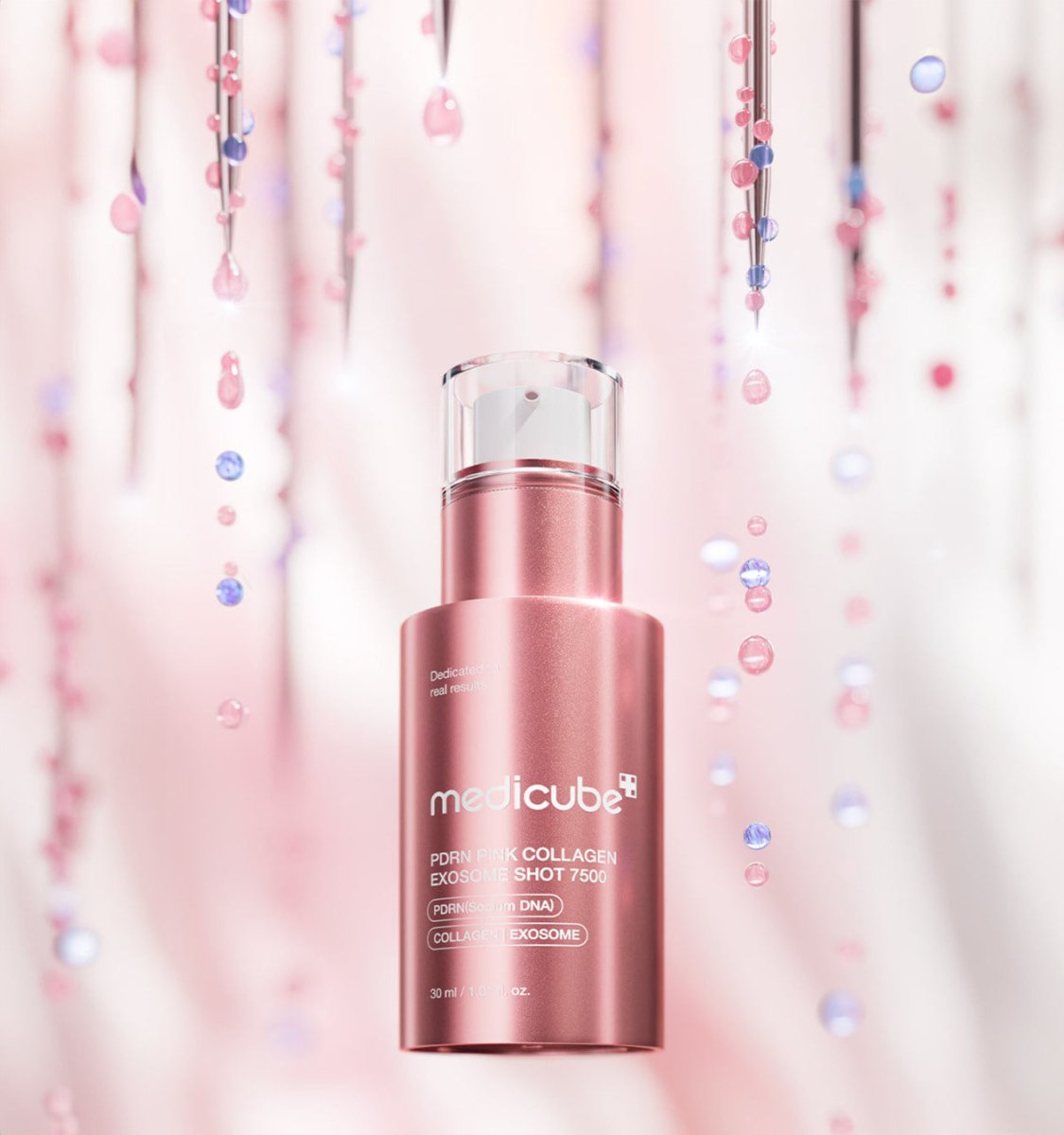 medicube PDRN Pink Collagen Exosome Shot 7500 30ml in rose pink bottle with cell regeneration focus and suspended serum droplets background