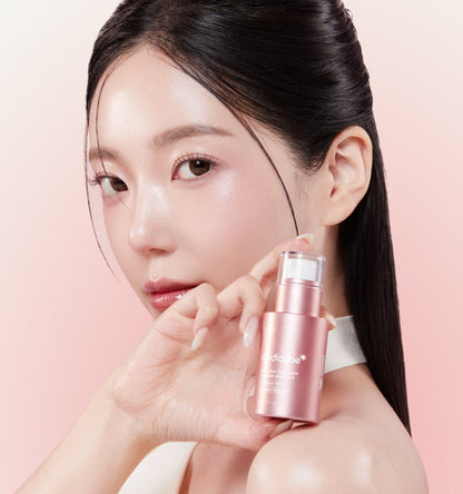 medicube PDRN Pink Collagen Exosome Shot 7500 30ml in rose gold bottle held by woman with glowing skin for cell regeneration
