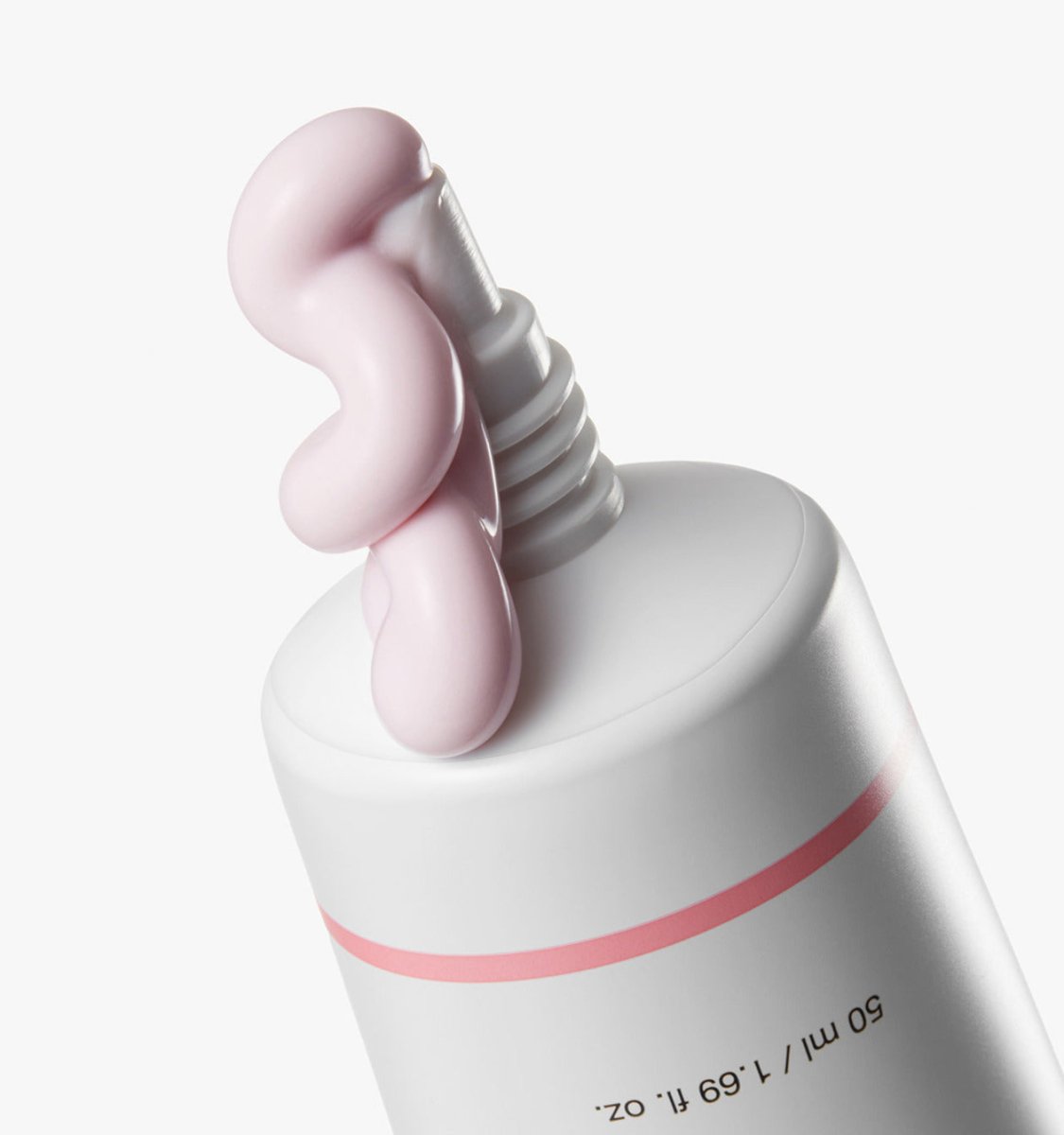 medicube PDRN Pink Tone Up Sun Cream 50ml with pale pink cream squeezed from white tube against white background